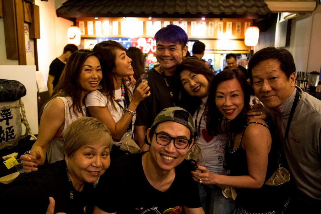 happy guests at shukuu izakaya sake bar with bar owner luis bar - candybar merchant stories